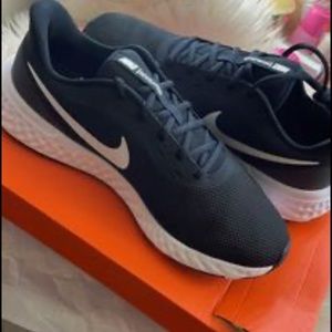 Never worn Nike shoes. Size 12 wide.